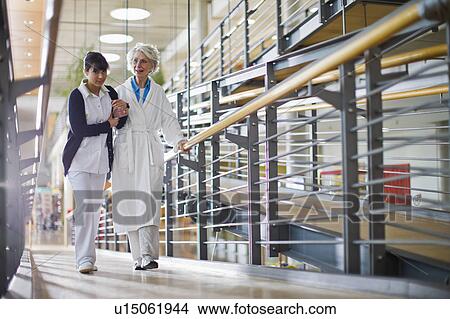 Picture - Old woman and nurse. Fotosearch