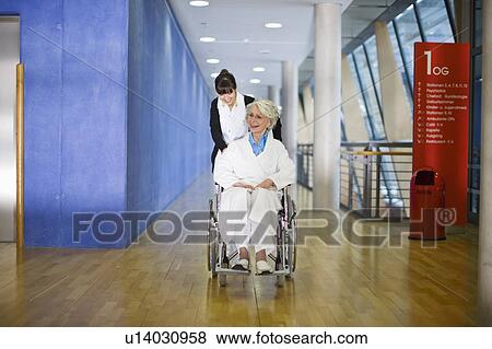 Old woman in a wheel chair and nurse View Large Photo Image Stock Photo - Old woman in a wheel chair and nurse. Fotosearch