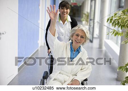 Old woman in a wheel chair and nurse View Large Photo Image Stock Photography - Old woman in a wheel chair and nurse. Fotosearch