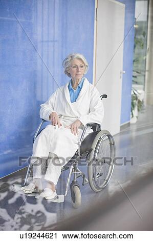 Old woman in a wheel chair View Large Photo Image Stock Image - Old woman in a wheel chair. Fotosearch