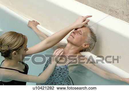 Older woman receiving water massage View Large Photo Image Stock Image - Older woman receiving water massage. Fotosearch