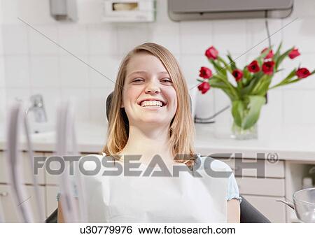 Patient in dental surgery View Large Photo Image Stock Photograph - Patient in dental surgery. Fotosearch
