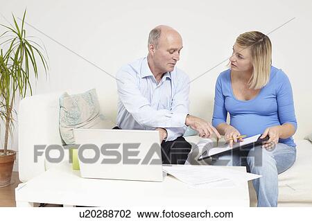 People discussing paperwork View Large Photo Image Stock Image - People discussing paperwork. Fotosearch