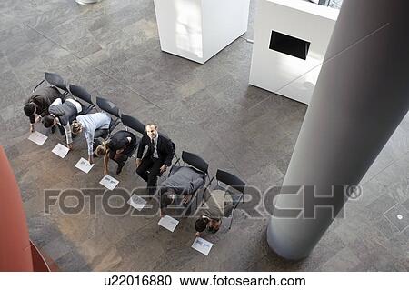 People sitting working with papers View Large Photo Image Stock Image - People sitting working with papers. Fotosearch