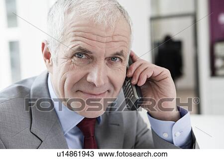 Phoning man looking at camera View Large Photo Image Stock Image - Phoning man looking at camera. Fotosearch