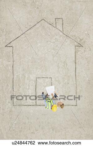 Stock Image - Planning a house. Fotosearch