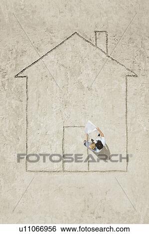 Stock Photograph - Planning a house. Fotosearch