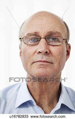 Stock Image - Portrait of a man in glasses. Fotosearch