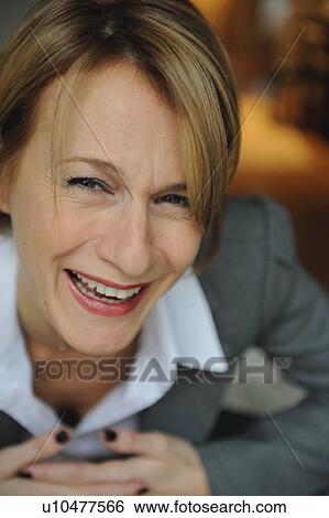 Stock Photograph - Portrait of a smiling woman. Fotosearch