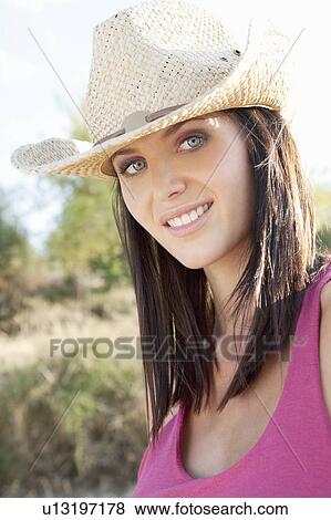 Portrait of a woman in a cowgirl hat View Large Photo Image Stock Photo - Portrait of a woman in a cowgirl hat. Fotosearch