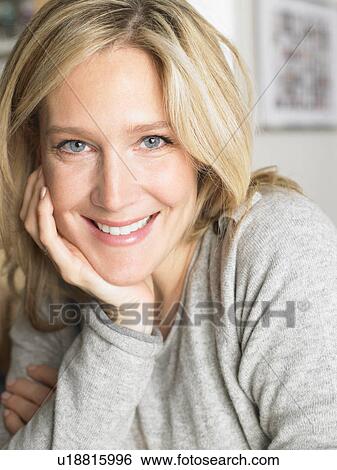 Stock Photograph - Portrait of a woman smiling. Fotosearch