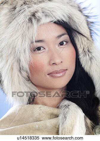 Stock Photography - Portrait of a woman wearing a fur hat. Fotosearch
