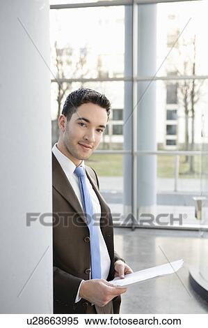 Portrait of a young businessman View Large Photo Image Stock Photography - Portrait of a young businessman. Fotosearch