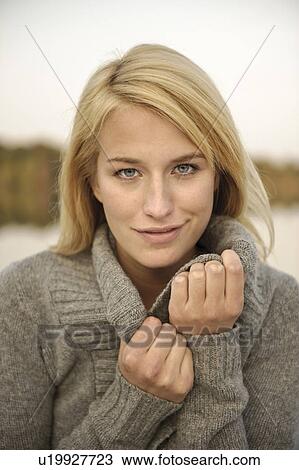 Portrait of a young woman, smiling View Large Photo Image Stock Image - Portrait of a young woman, smiling. Fotosearch