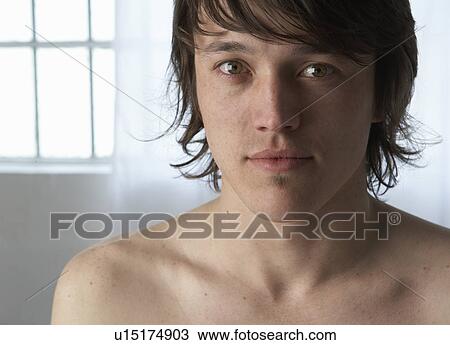Stock Image - Portrait of bare chested young man. Fotosearch