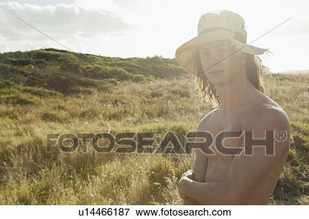 Portrait of bare chested young man View Large Photo Image Stock Photo - Portrait of bare chested young man. Fotosearch