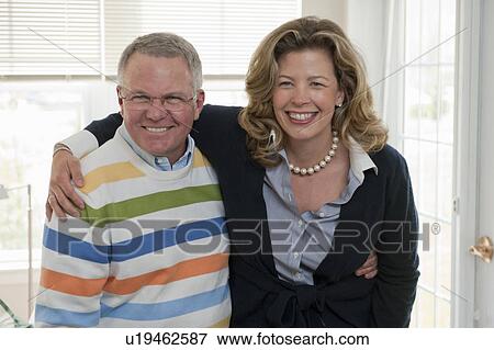 Stock Photo - Portrait of father and daughter hugging. Fotosearch