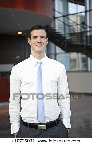 Stock Image - Portrait of friendly business man. Fotosearch