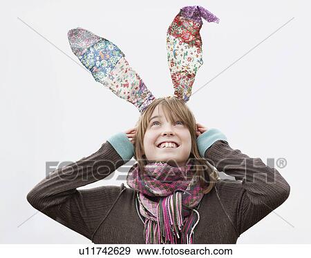 Stock Photo - Portrait of girl with bunny ears. Fotosearch
