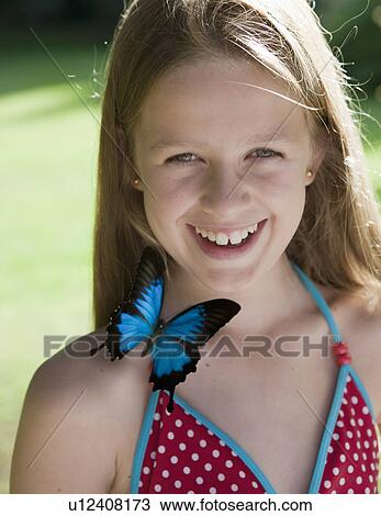 Stock Image - Portrait of girl with butterfly. Fotosearch