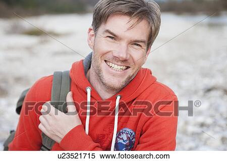 Stock Photography - Portrait of man in sportswear smiling. Fotosearch