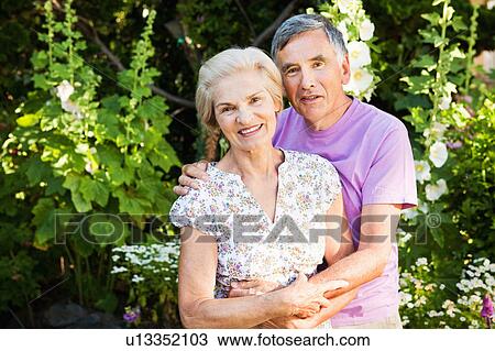 portrait of mature couple in garden. View Large Photo Image Stock Image - portrait of mature couple in garden.. Fotosearch