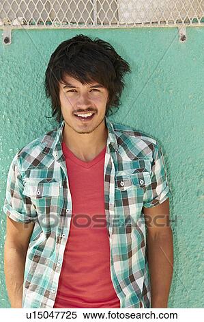 Portrait of smiling young man View Large Photo Image Stock Photography - Portrait of smiling young man. Fotosearch
