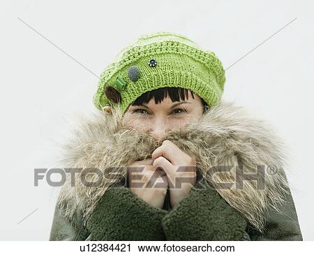 Stock Image - Portrait of woman in winter clothing. Fotosearch