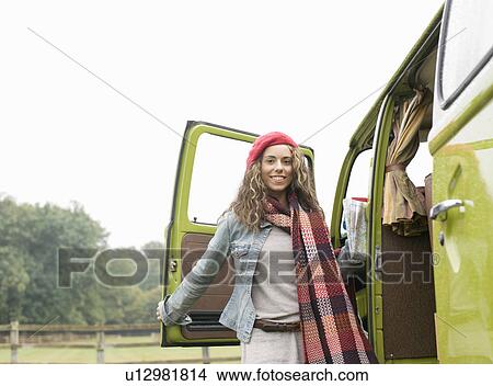 Portrait of woman next to camper van View Large Photo Image Picture - Portrait of woman next to camper van. Fotosearch