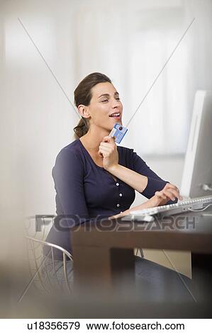 Pregnant woman doing online shopping View Large Photo Image Stock Photo - Pregnant woman doing online shopping. Fotosearch