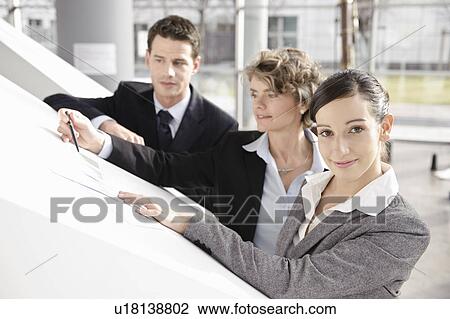 Stock Image - Presentation with business team. Fotosearch