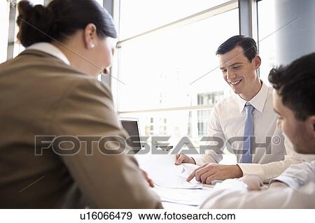Presentation with young business team View Large Photo Image Stock Photo - Presentation with young business team. Fotosearch