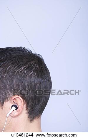 profile head cropped, headphone in ear View Large Photo Image Picture - profile head cropped, headphone in ear. Fotosearch