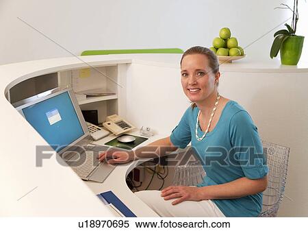 Stock Photography - Receptionist in surgery. Fotosearch