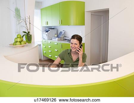 Stock Photograph - Receptionist on phone. Fotosearch