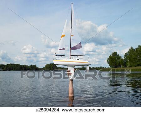 Picture - Remote-controlled boat above the water. Fotosearch