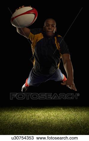 Rugby player about to score diving View Large Photo Image Stock Image - Rugby player about to score diving. Fotosearch
