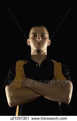 Rugby player with arms folded View Large Photo Image Stock Image - Rugby player with arms folded. Fotosearch