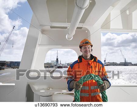 Sailor holding a tow rope View Large Photo Image Stock Image - Sailor holding a tow rope. Fotosearch