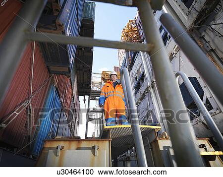 Sailor in cargo area on a lift View Large Photo Image Stock Image - Sailor in cargo area on a lift. Fotosearch