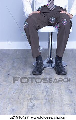 seated business man legs cropped shot View Large Photo Image Stock Photo - seated business man legs cropped shot. Fotosearch