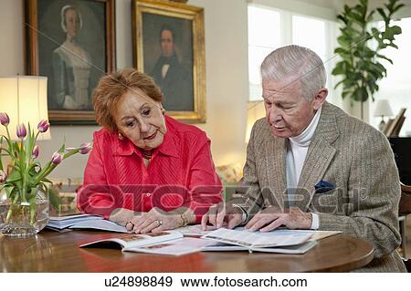 Senior couple planning a vacation View Large Photo Image Stock Photo - Senior couple planning a vacation. Fotosearch