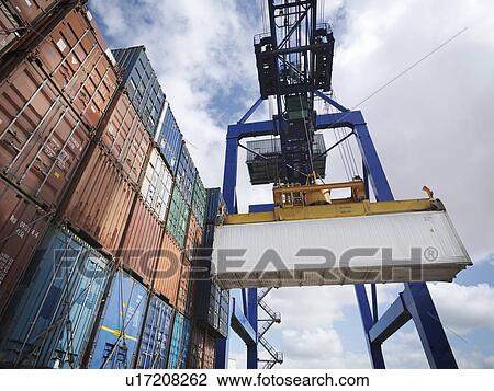Shipping containers with gantry crane View Large Photo Image Stock Image - Shipping containers with gantry crane. Fotosearch
