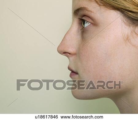 Stock Photograph - Side view of young woman. Fotosearch