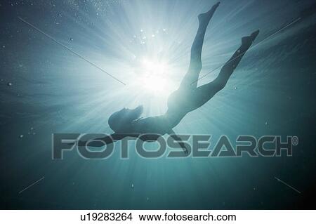 Silhouette of a girl underwater View Large Photo Image Picture - Silhouette of a girl underwater. Fotosearch