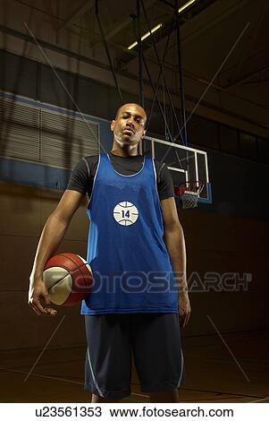 Single basketball player and ball View Large Photo Image Stock Image - Single basketball player and ball. Fotosearch
