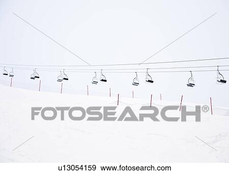 Stock Photo - Ski lifts in snow scene. Fotosearch