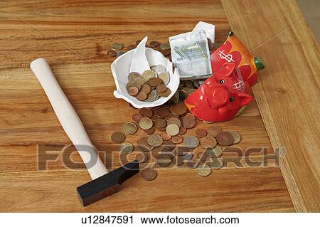 Smashed piggy bank with euros and hammer View Large Photo Image Stock Image - Smashed piggy bank with euros and hammer. Fotosearch