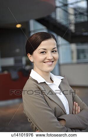 Smiling business woman in office View Large Photo Image Stock Photograph - Smiling business woman in office. Fotosearch