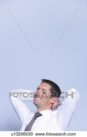 smiling businessman looking relaxed View Large Photo Image Stock Image - smiling businessman looking relaxed. Fotosearch